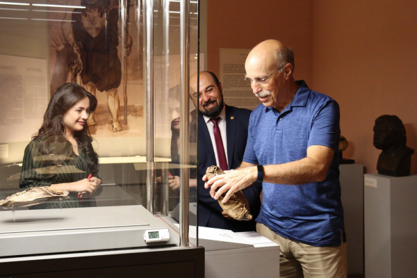James Bagian, the first cosmonaut of Armenian origin, presents badges to the History Museum of Armenia